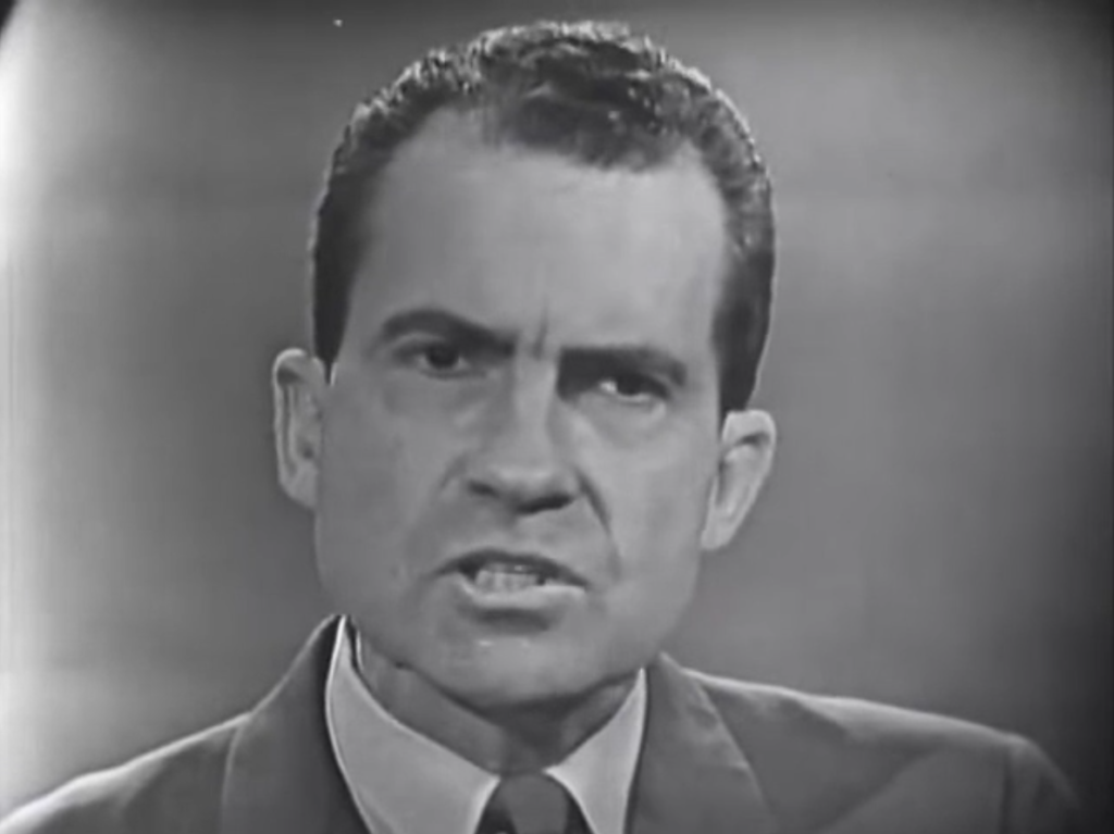 Nixon bares his teeth